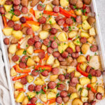 Sheet pan sausage and potatoes with roasted peppers and onions
