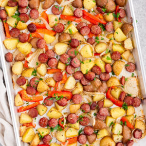 Sheet pan sausage and potatoes with roasted peppers and onions