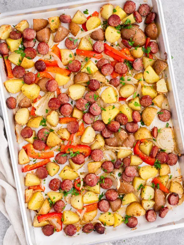 Sheet pan sausage and potatoes with roasted peppers and onions